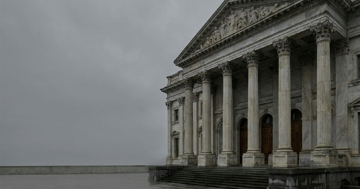 Classical marble columns and government building exterior under overcast sky, institutional architecture.