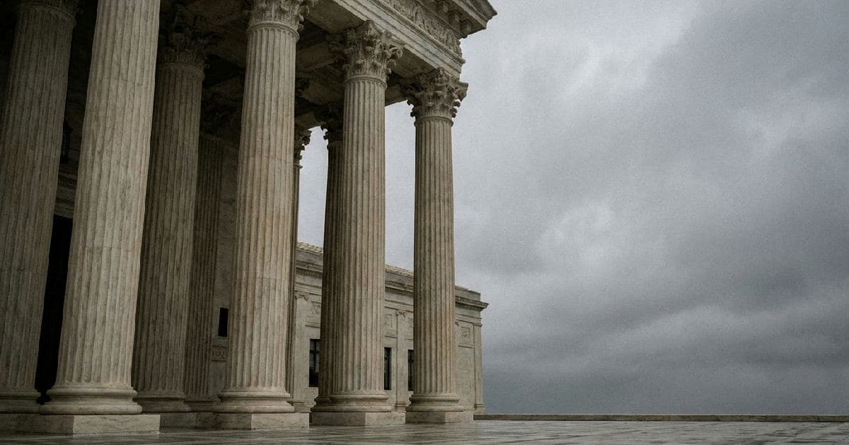 Classical marble government building columns under overcast sky, architectural detail with no people visible.