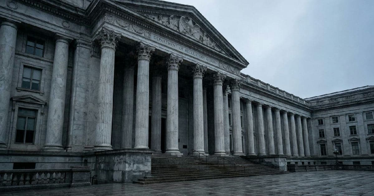 Classical marble columns of a government building under overcast sky, empty and institutional.